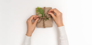 The perfect Christmas present hands wrapping a present