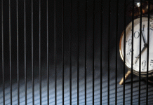 Caught between the hands of a clock Caught between the hands of a clock