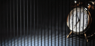 Caught between the hands of a clock Caught between the hands of a clock